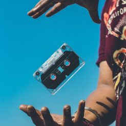 person doing tricks on cassette tape