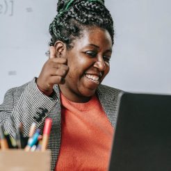 positive black teacher showing thumb up during online test