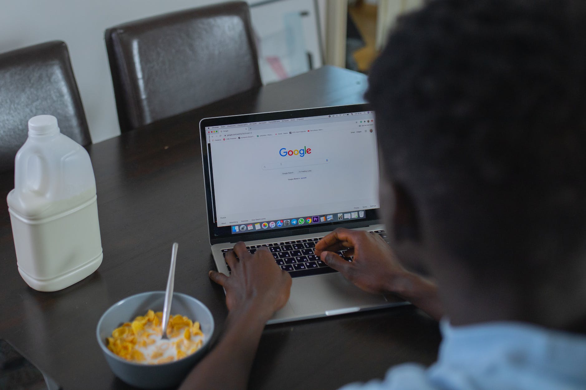 a person using google website on a laptop