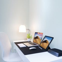 photo of a laptop and a tablet on the table