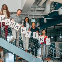 coworkers standing on a stairway