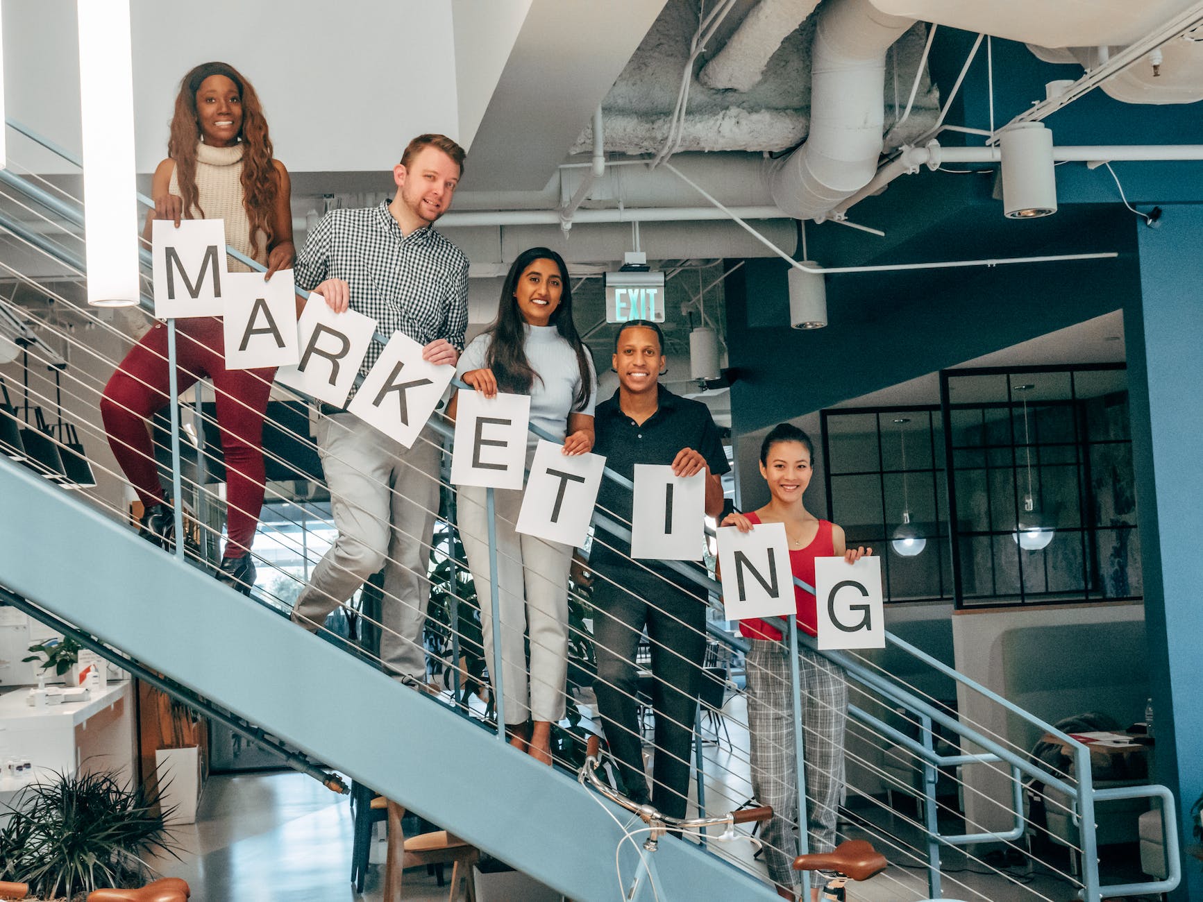 coworkers standing on a stairway