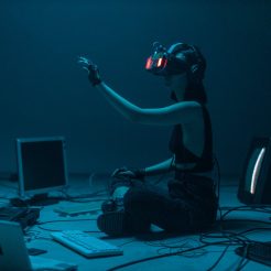 a woman in a tank top using a vr headset