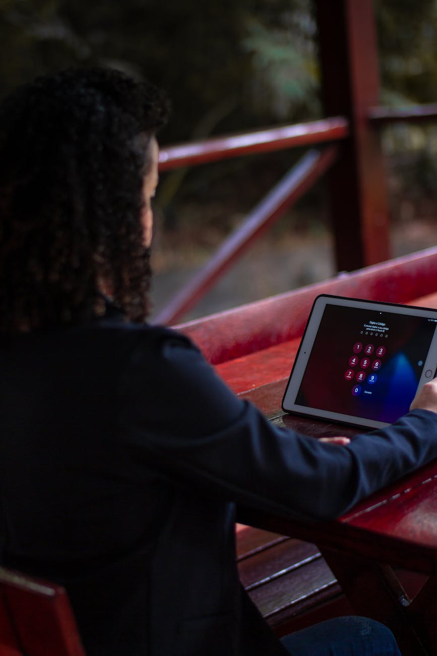 a person looking at a tablet screen with password