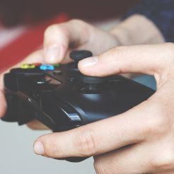 man holding black game controller