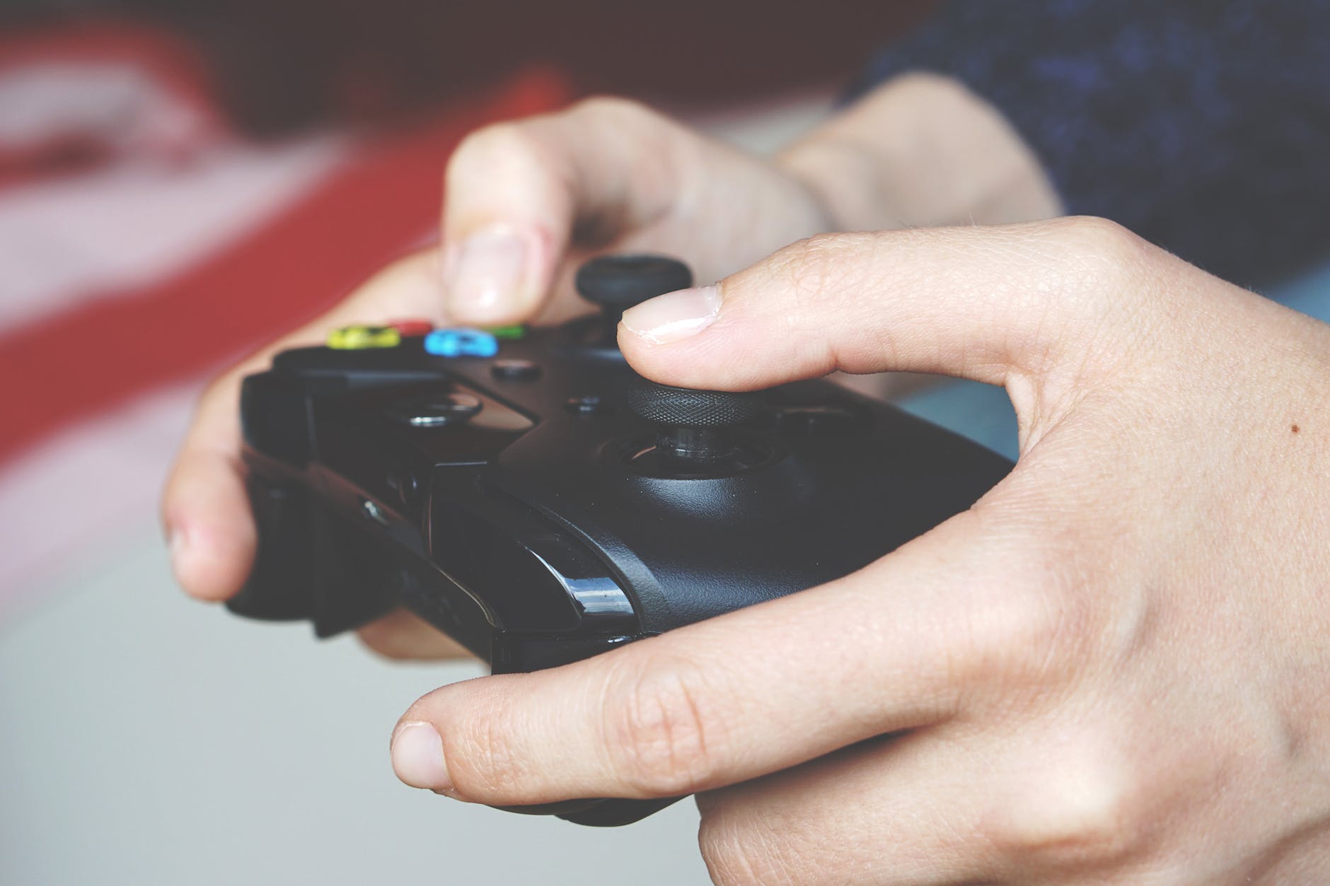 man holding black game controller