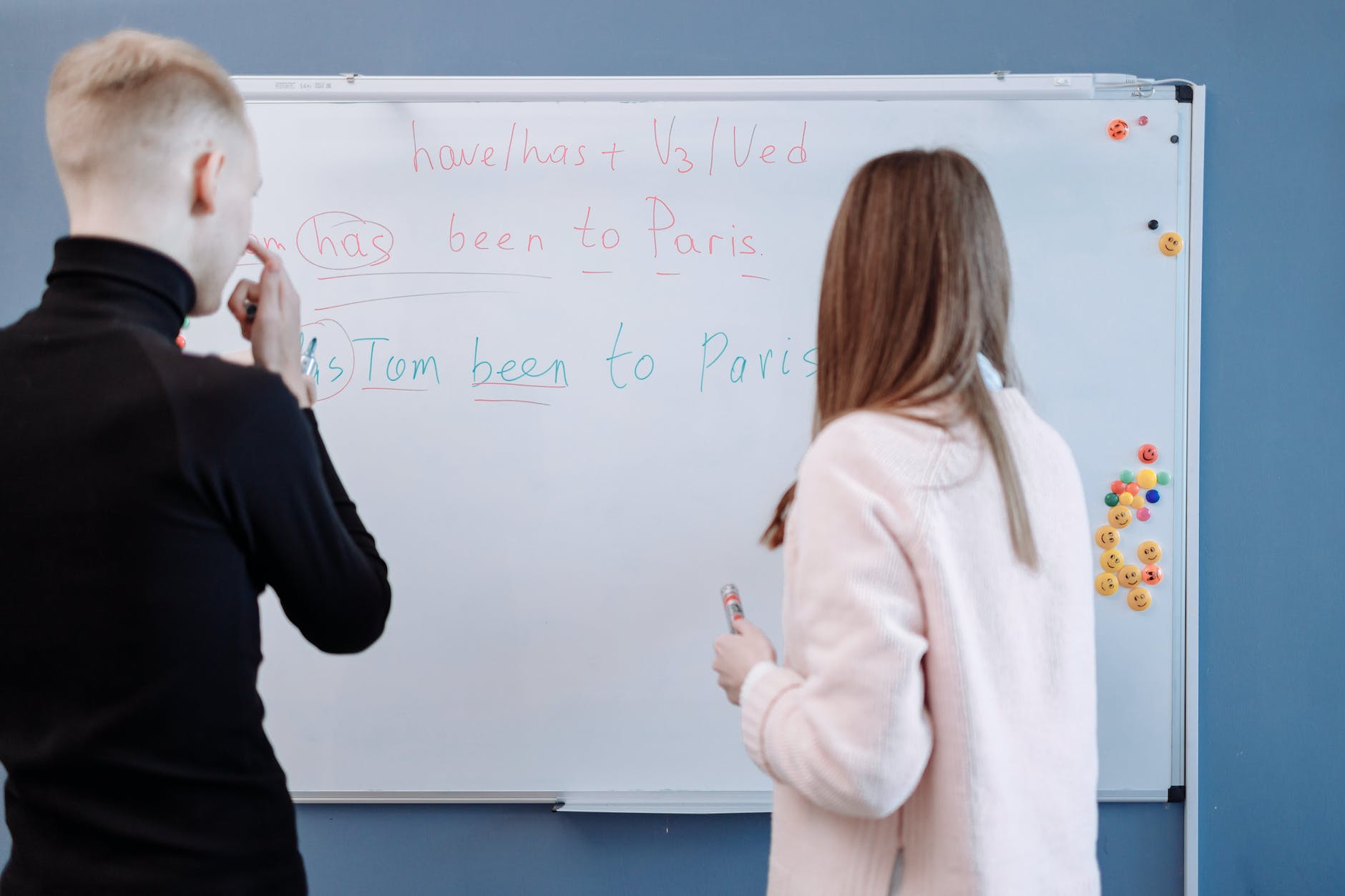 a female teacher tutoring her male student