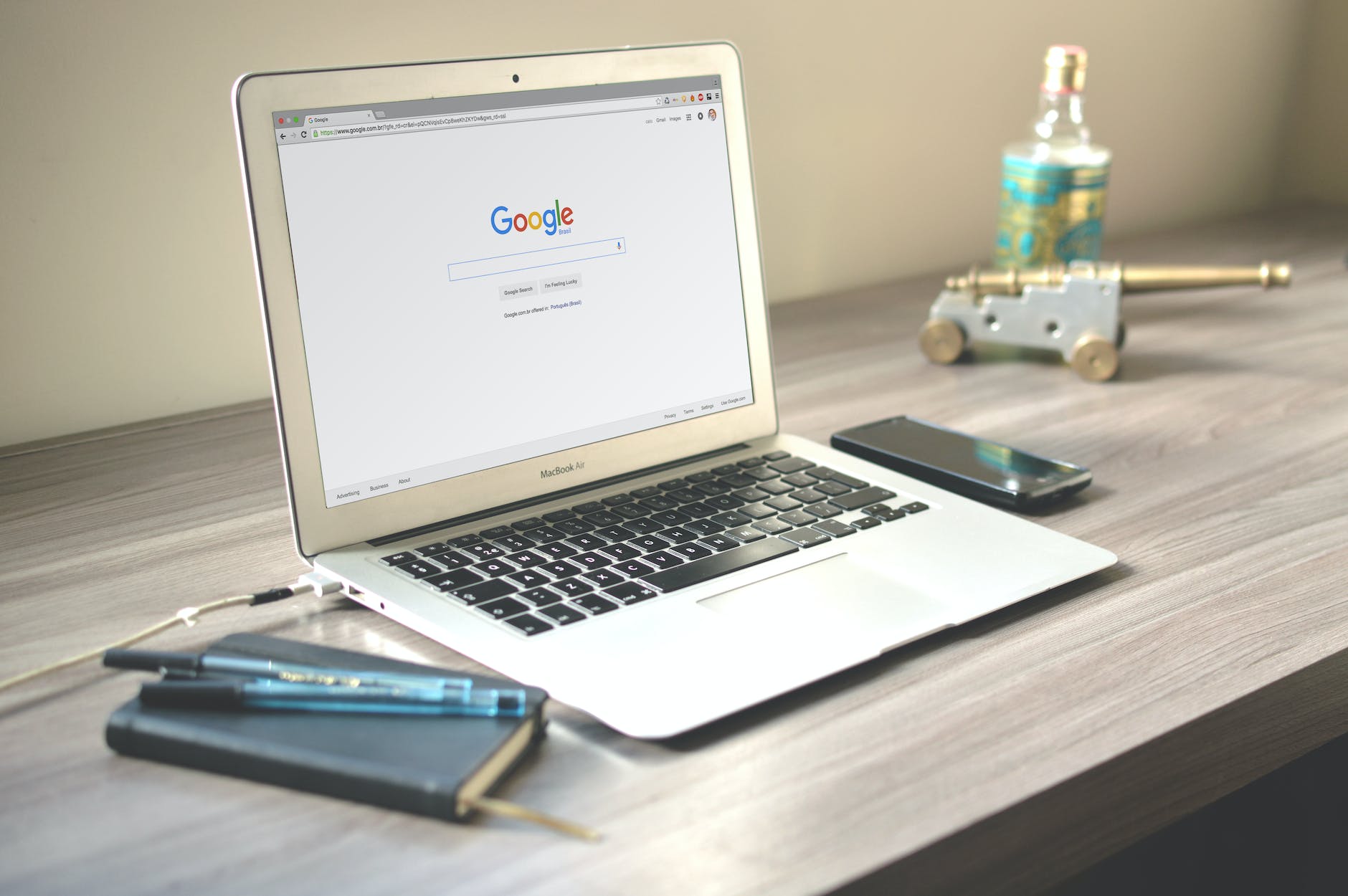 macbook air on grey wooden table