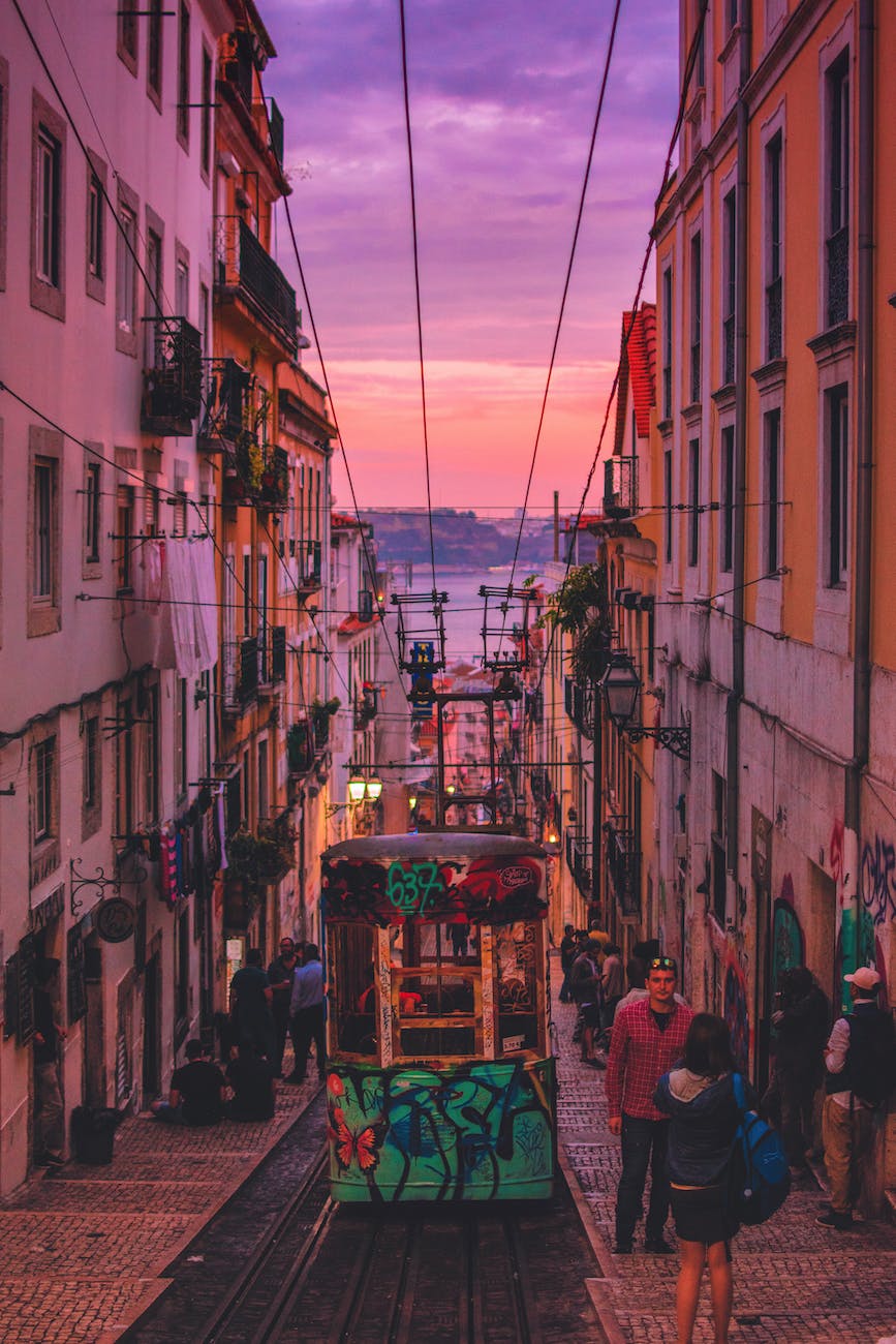 people walking between buildings