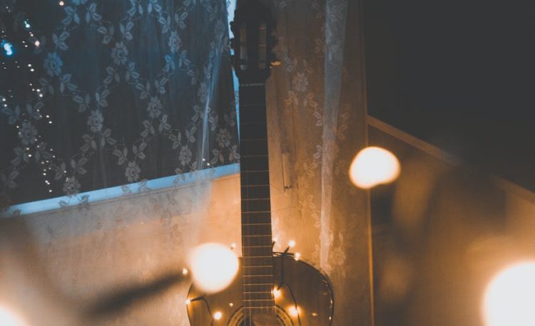 guitar covered with string lights