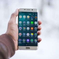 person holding silver android smartphone