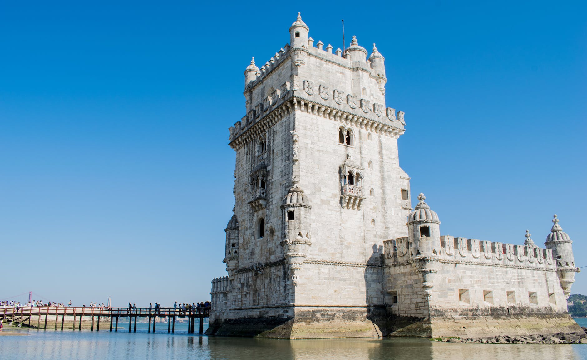 white castle beside body of water