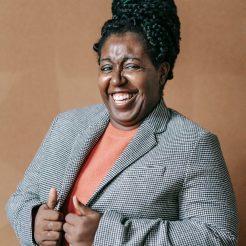 laughing formal woman in elegant jacket