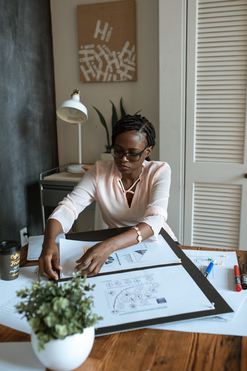 photo of woman working on white paper