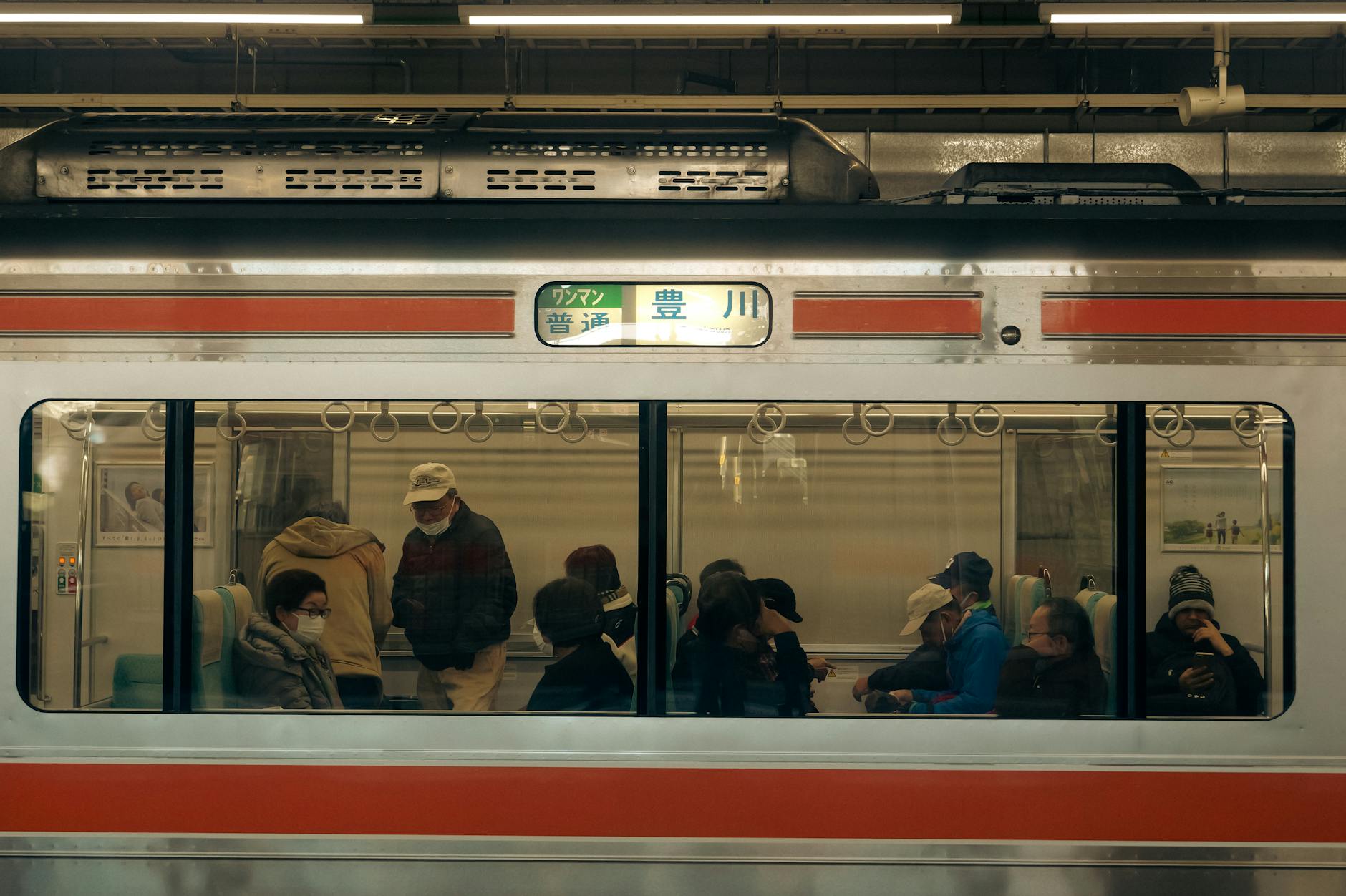 people travelling on a subway train in japan