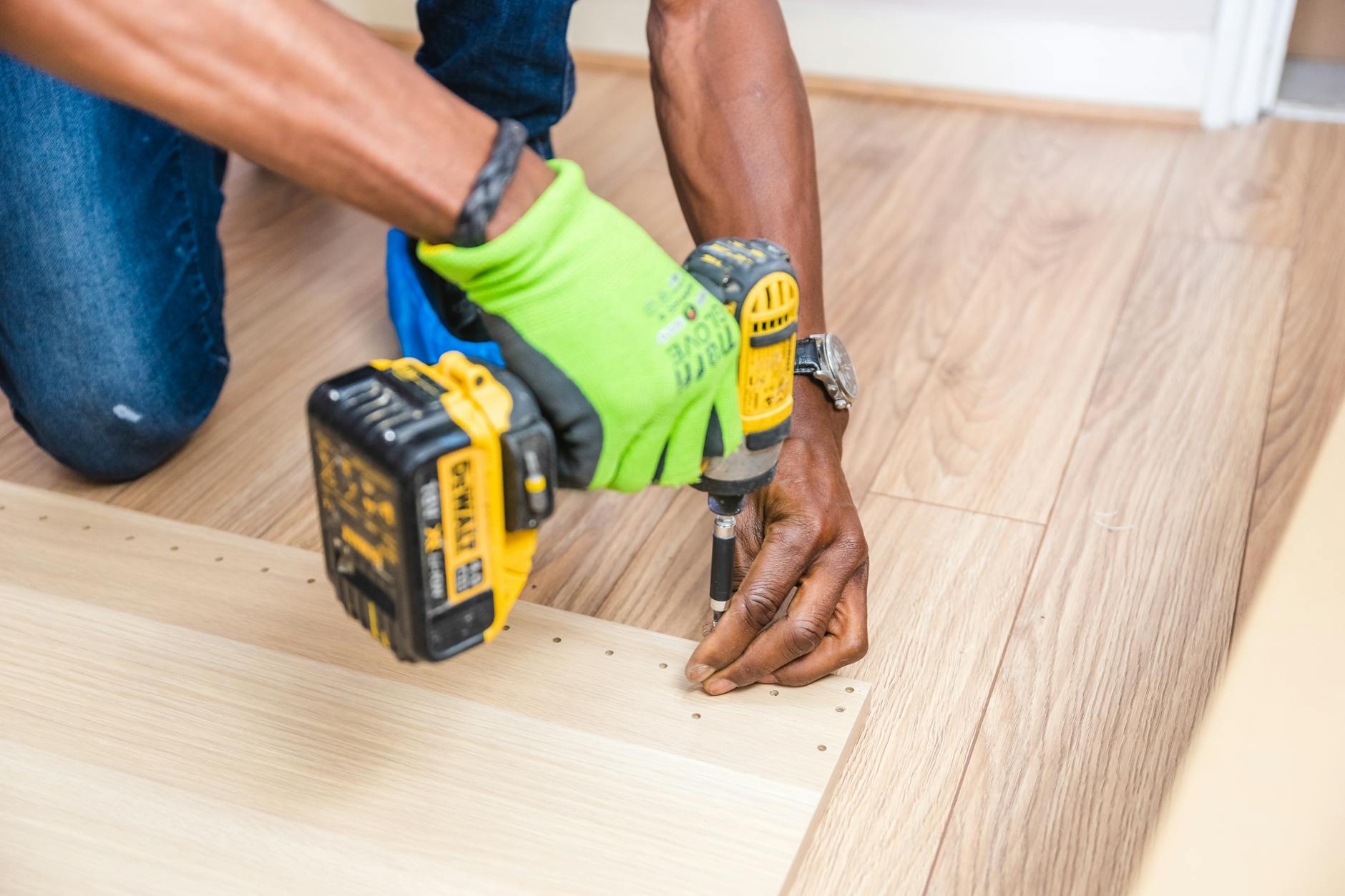 person holding dewalt cordless hand drill