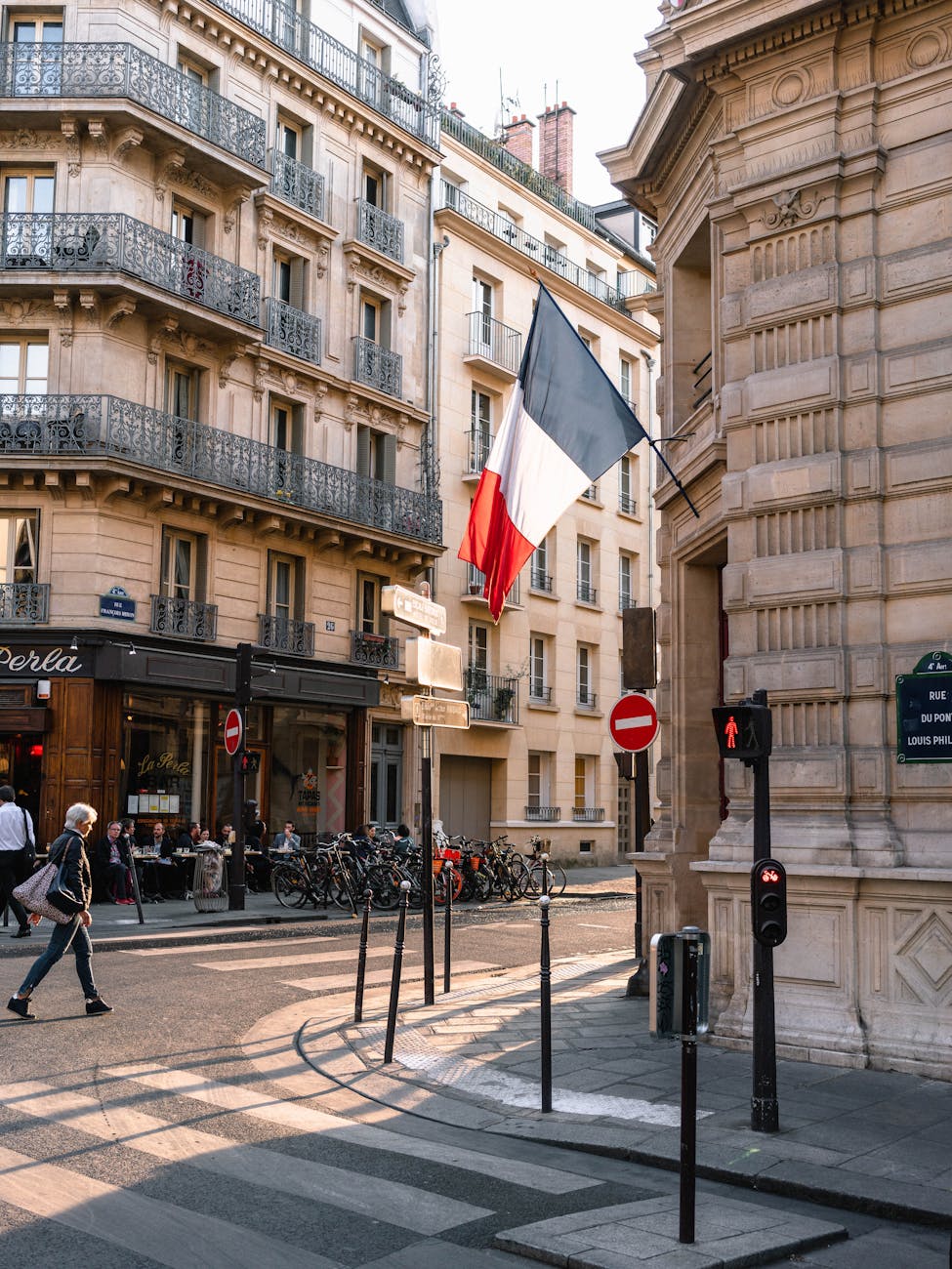 france flag on gray concrete building near road