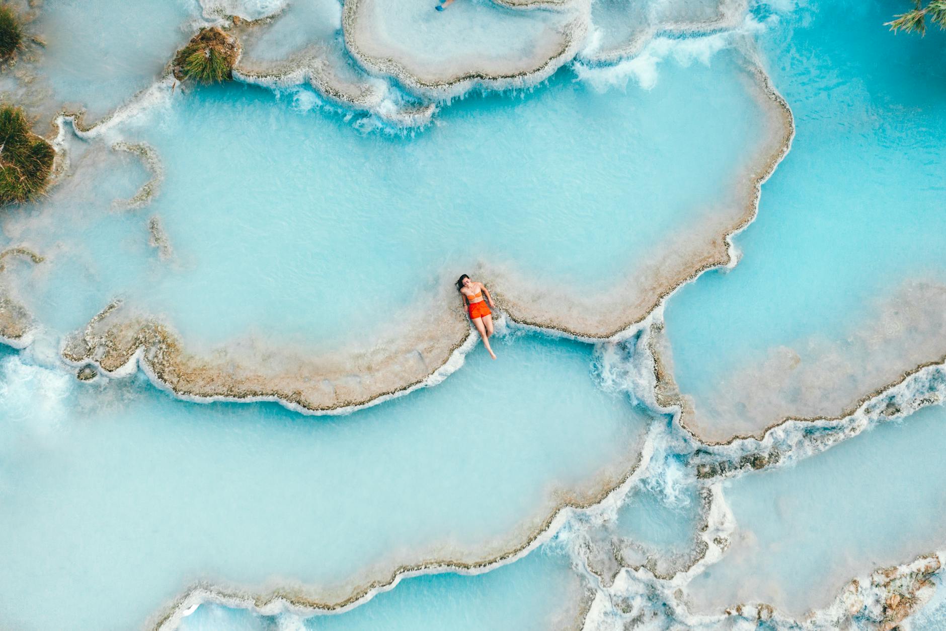 tourist relaxing in the hot springs of tuscany