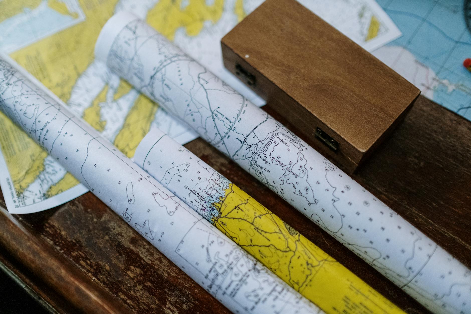 close up photo of rolled maps