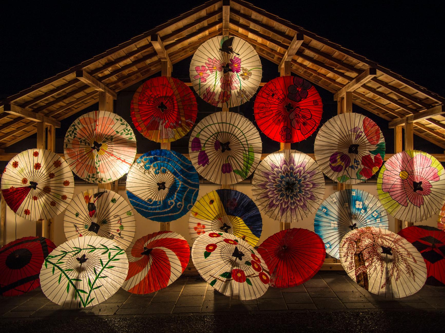 red and white umbrella during night time