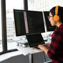 woman sitting in front laptop