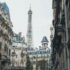 eiffel tower behind buildings