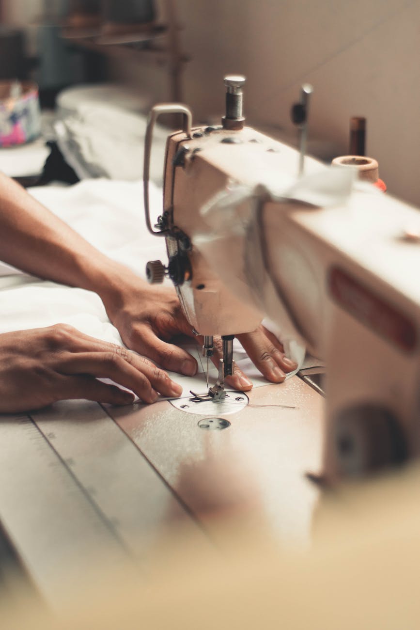 person holding sewing machine