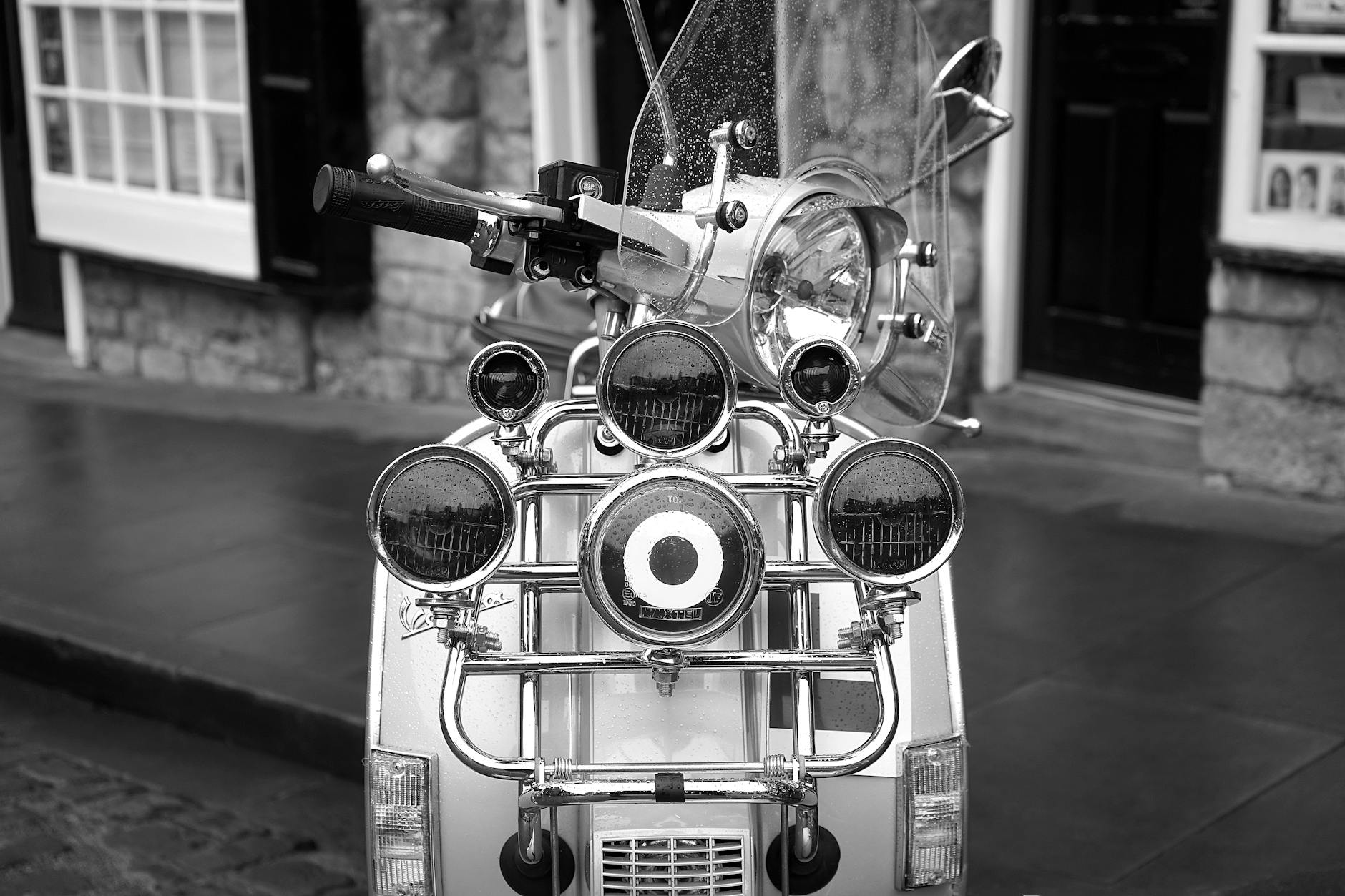 grayscale photo of scooter motorcycle