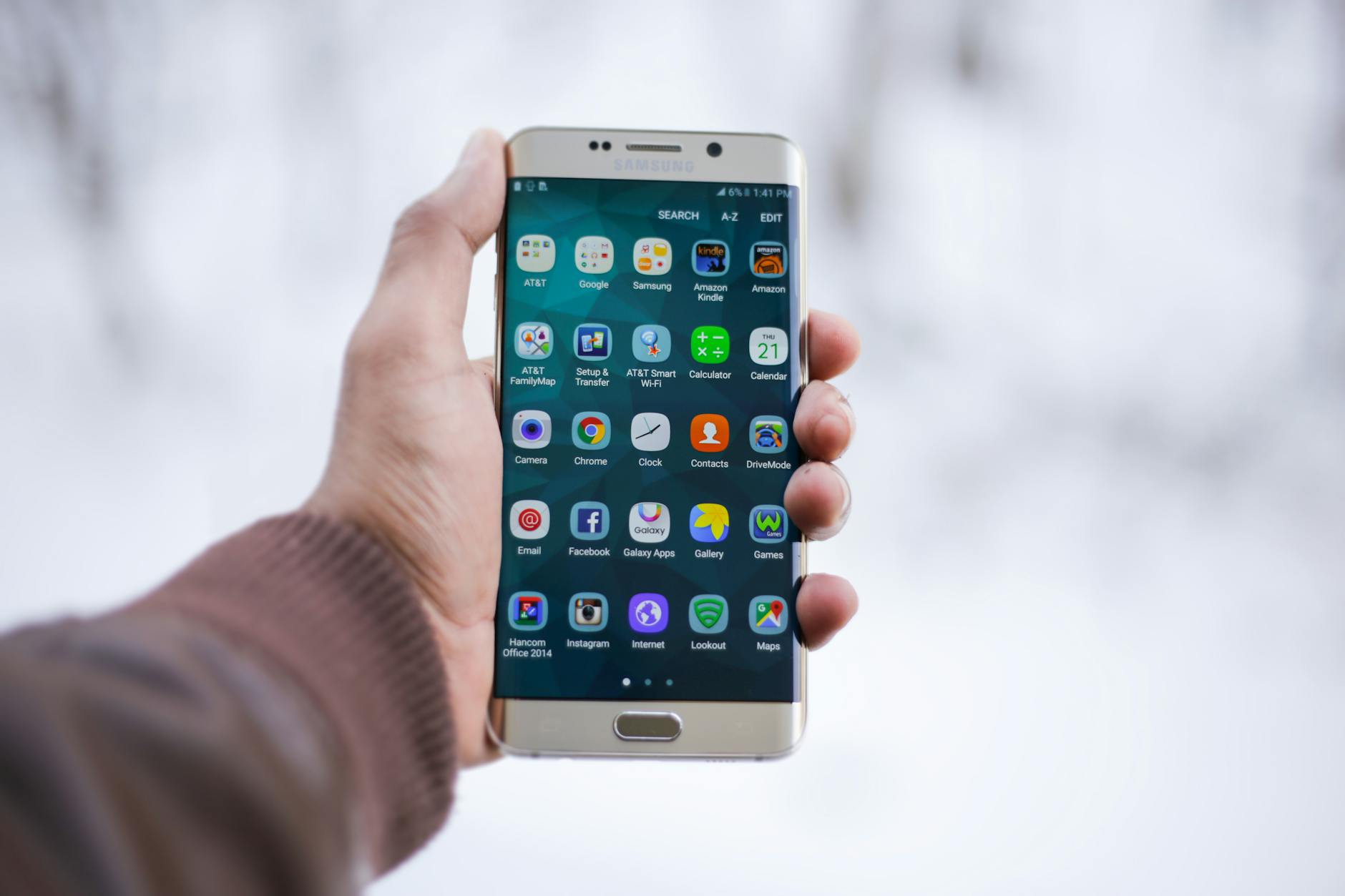 person holding silver android smartphone