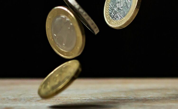 coins on brown wood